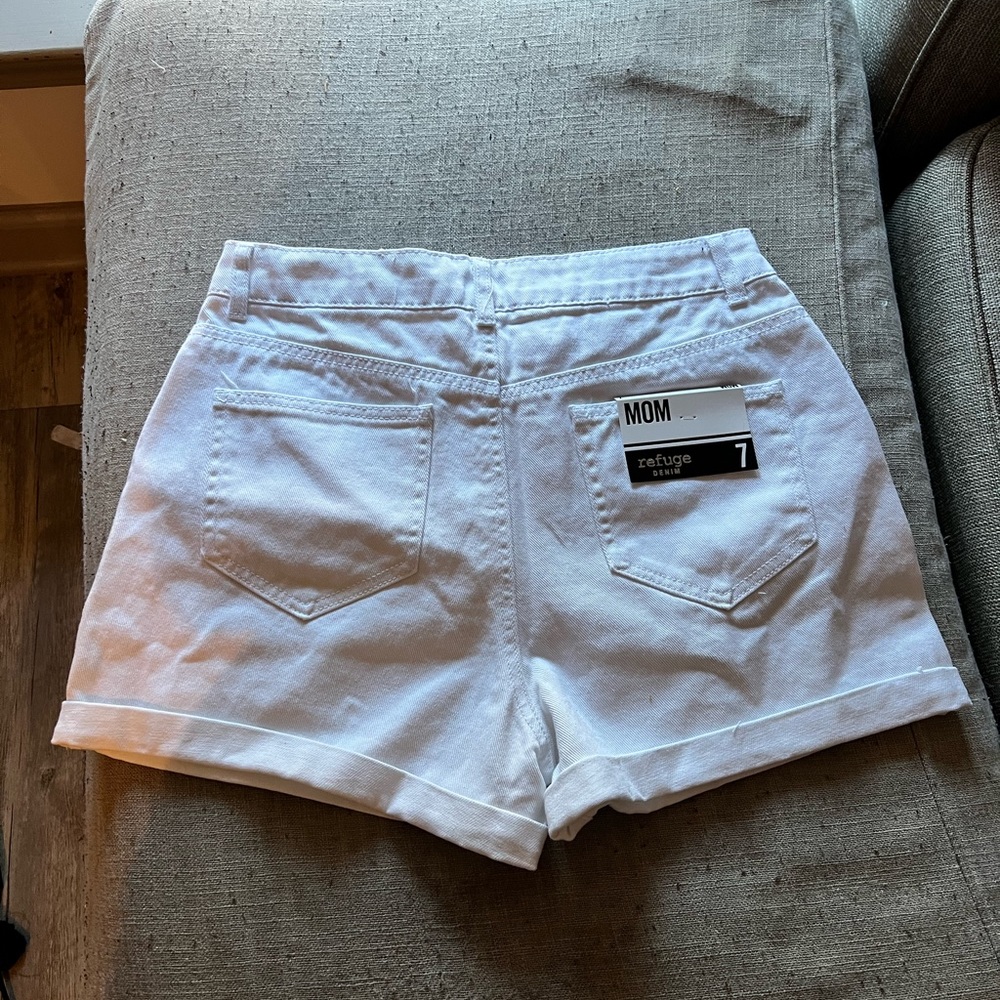 White distressed denim shorts. Never worn size 7